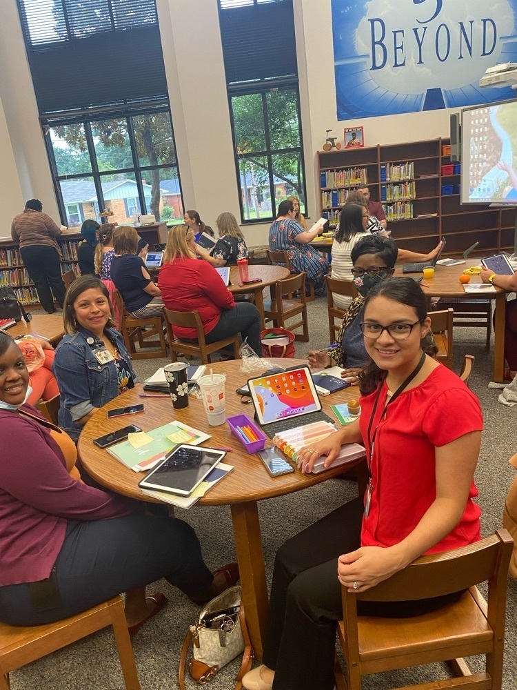Teachers sitting in training!
