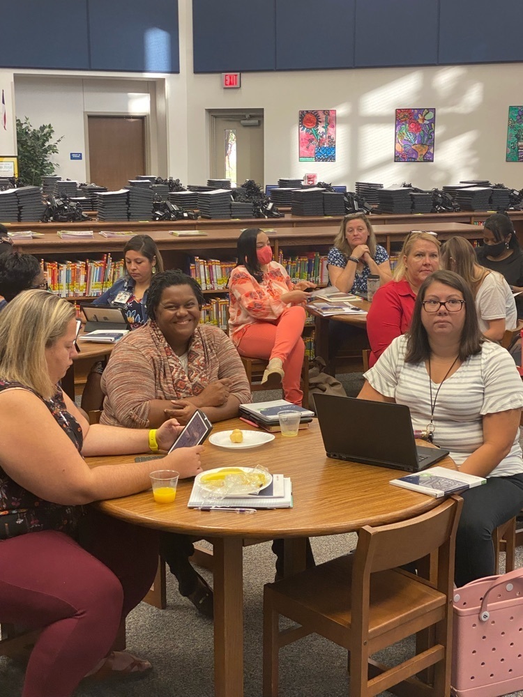 Teachers sitting in training!