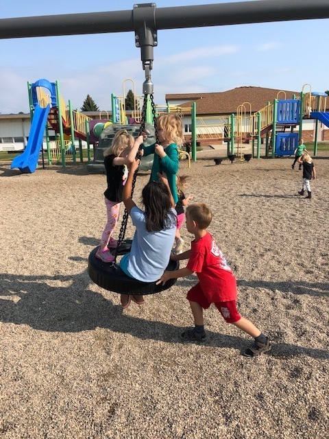 Swinging on the new tire swing.