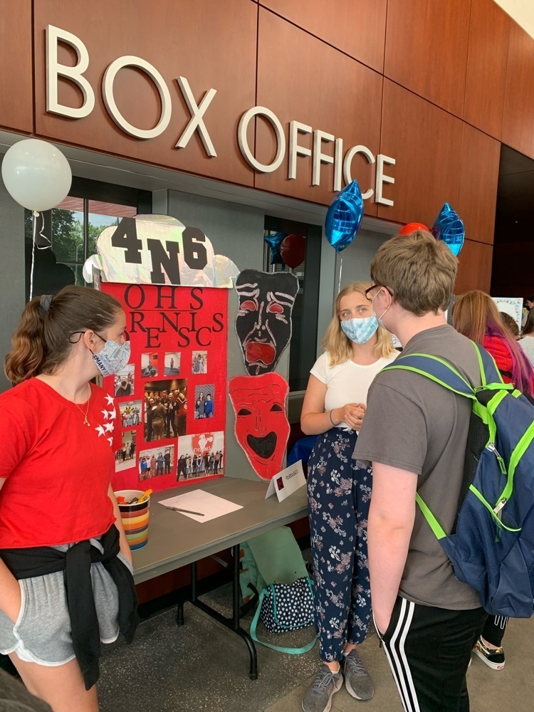 students taking to other students about a group