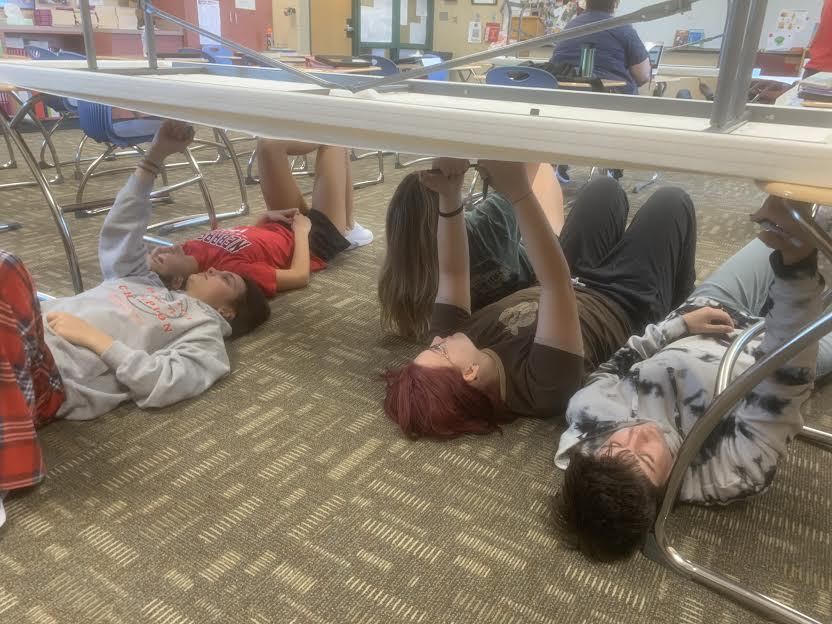 Students in Mrs. Grant's English 10 class practice creating their own "Sistine Chapel" artwork. The students learned about The Italian Renaissance in Mr. Nordgren's World History Class and then drew pictures from their favorite pieces of literature in Mrs. Grant's English class. 