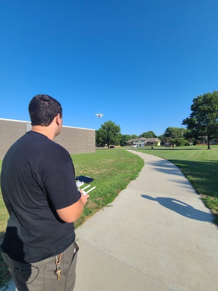 student flying a drone 