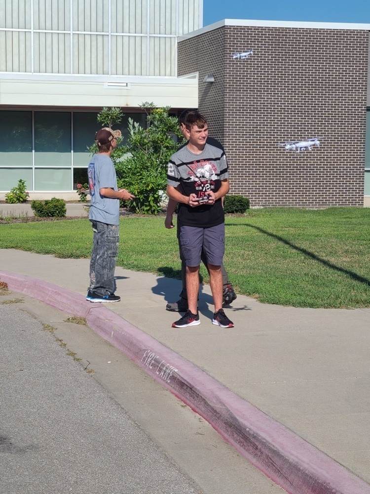 student flying a drone 