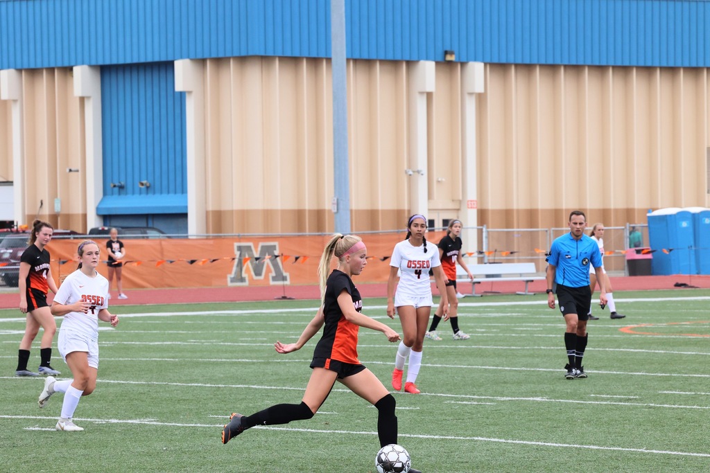 girl playing soccer