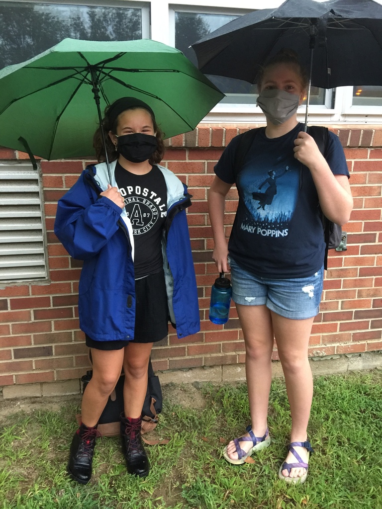 two girls with umbrellas