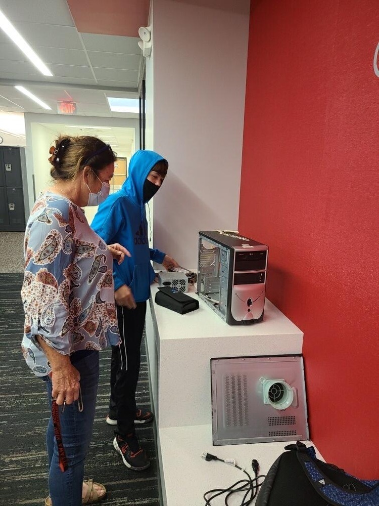 teacher working with a student 
