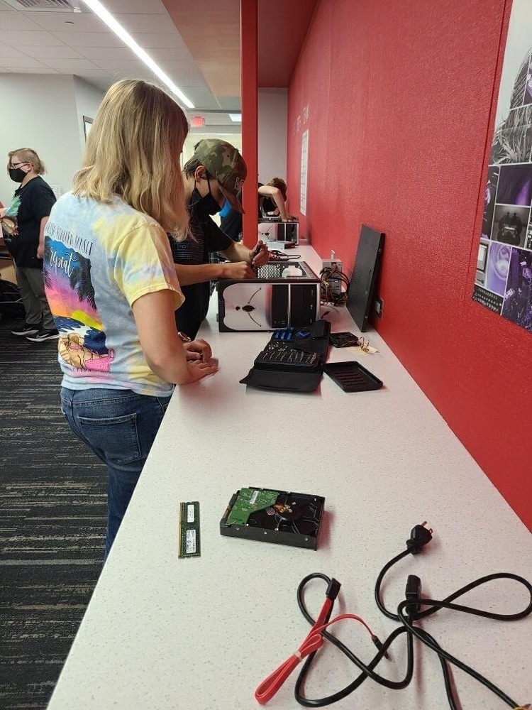 students fixing a computer 