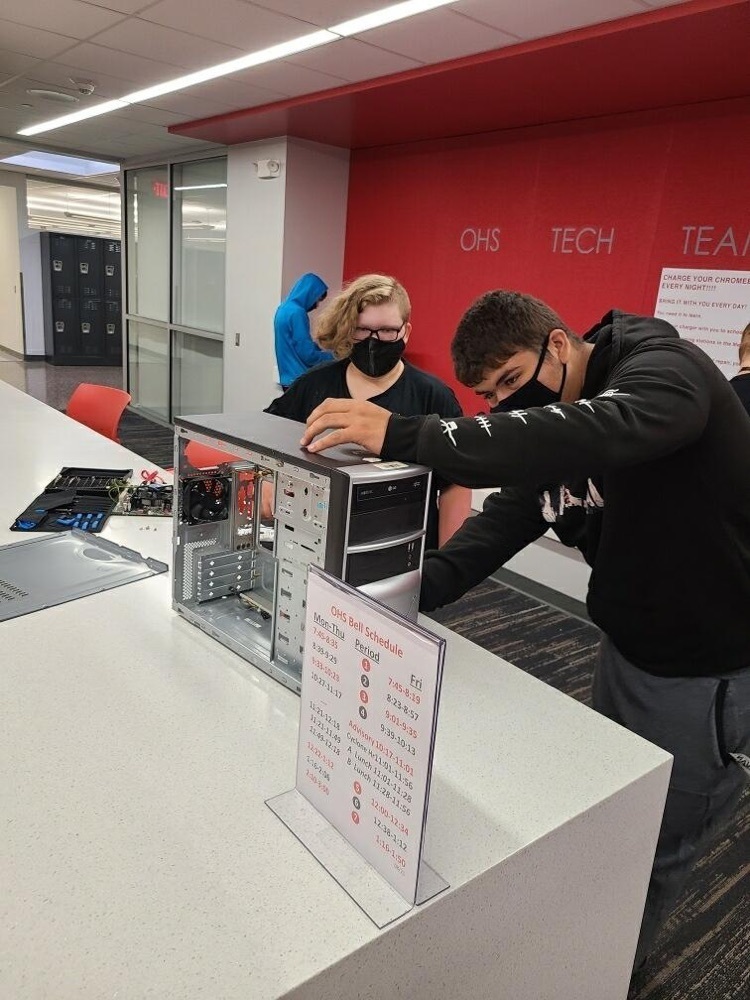 students fixing a computer 