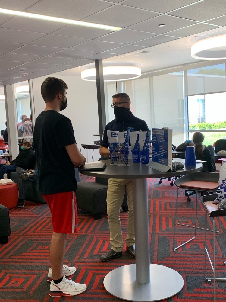 student talking with a college representative 