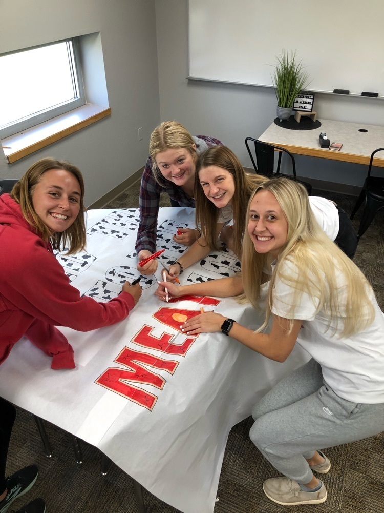 Students working on Homecoming signs.