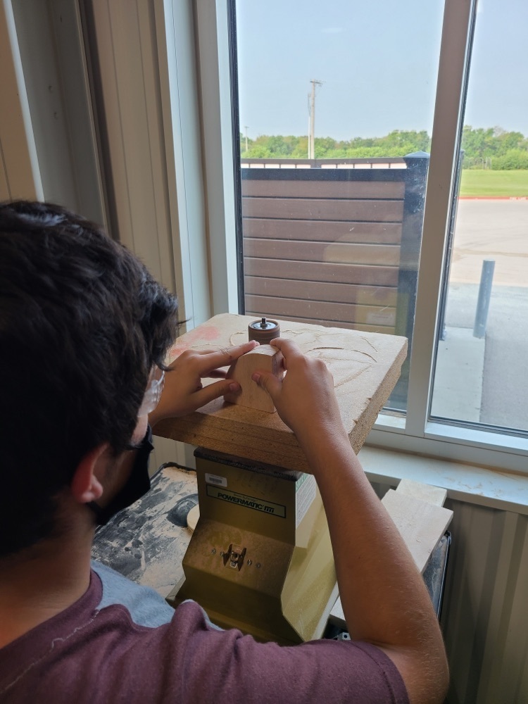 student using a tool