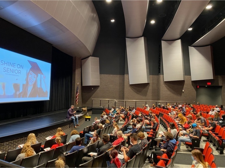Senior presentation to students sitting 