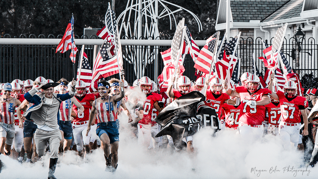 THS Football team running on field.