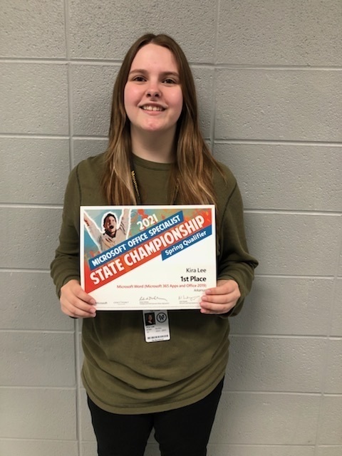 a teen girl holding a certificate 