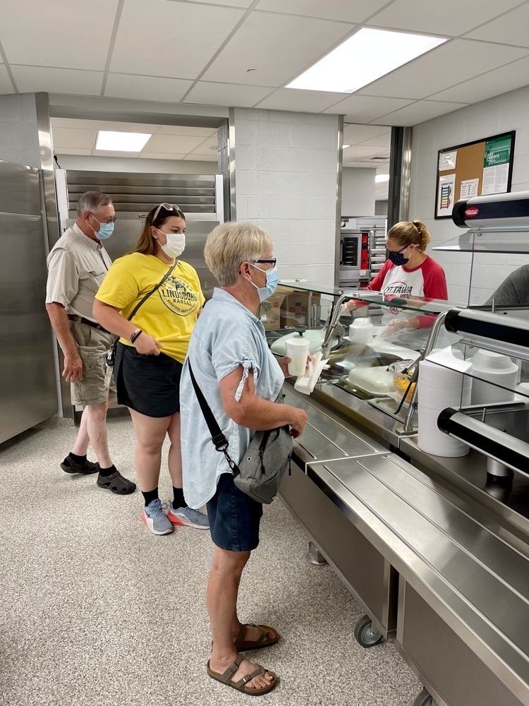 people picking up food 