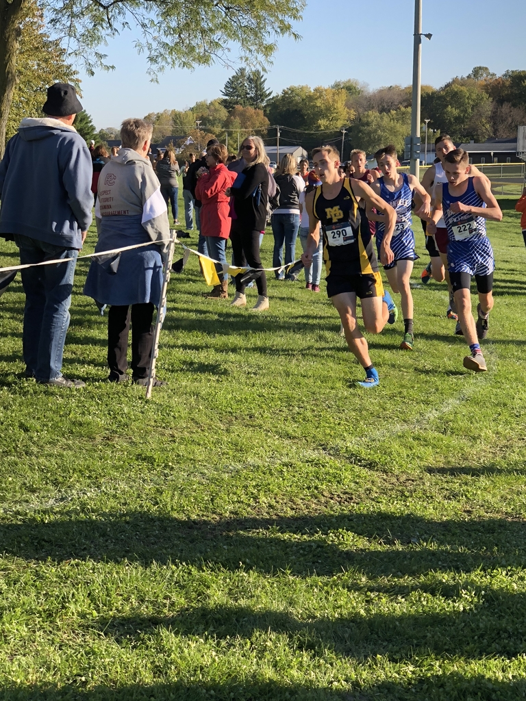 Quinn Schmidt rounds the corner during the district cross country meet.