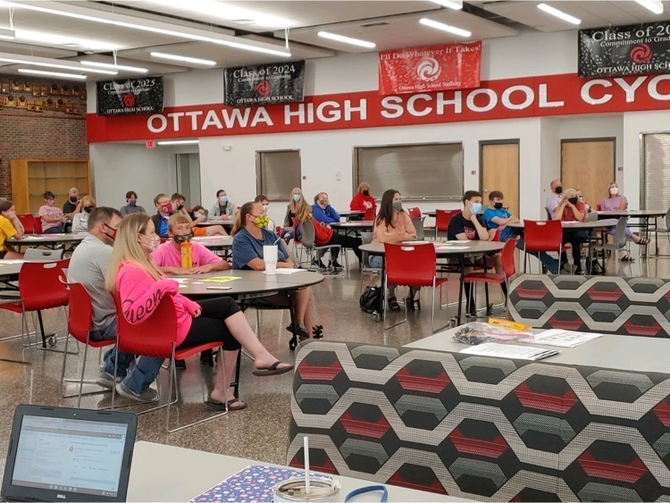 people listening to a presentation 