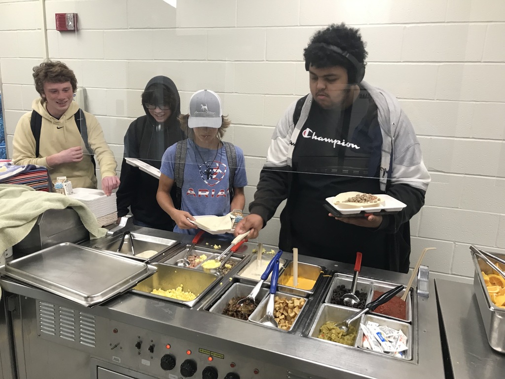 students in breakfast line for breakfast burrito