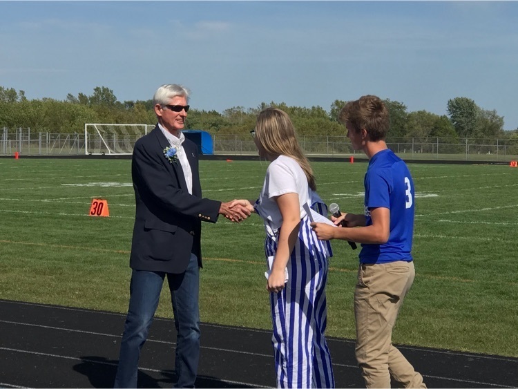 Glenn shaking students hand 