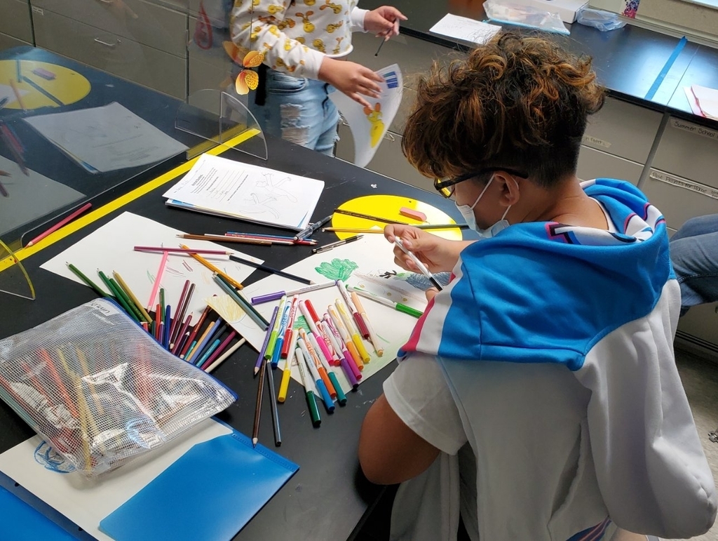Student working hard in art class
