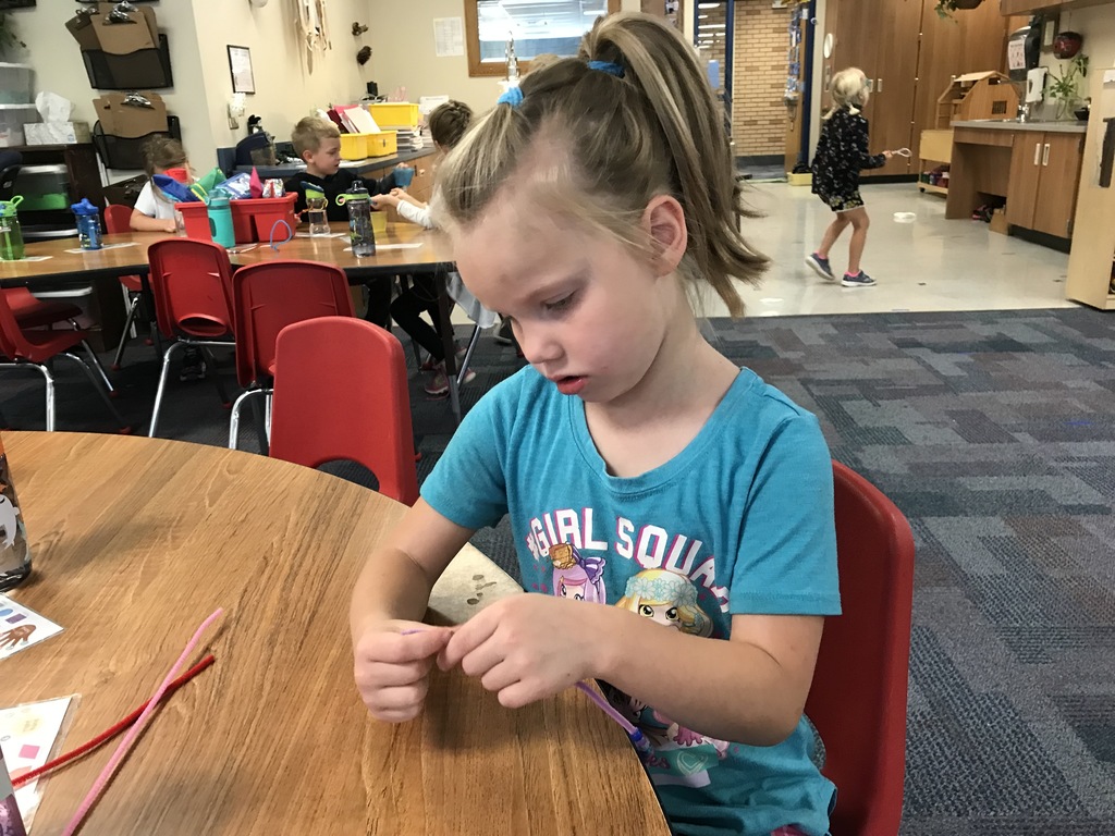 female student with pipe cleaners