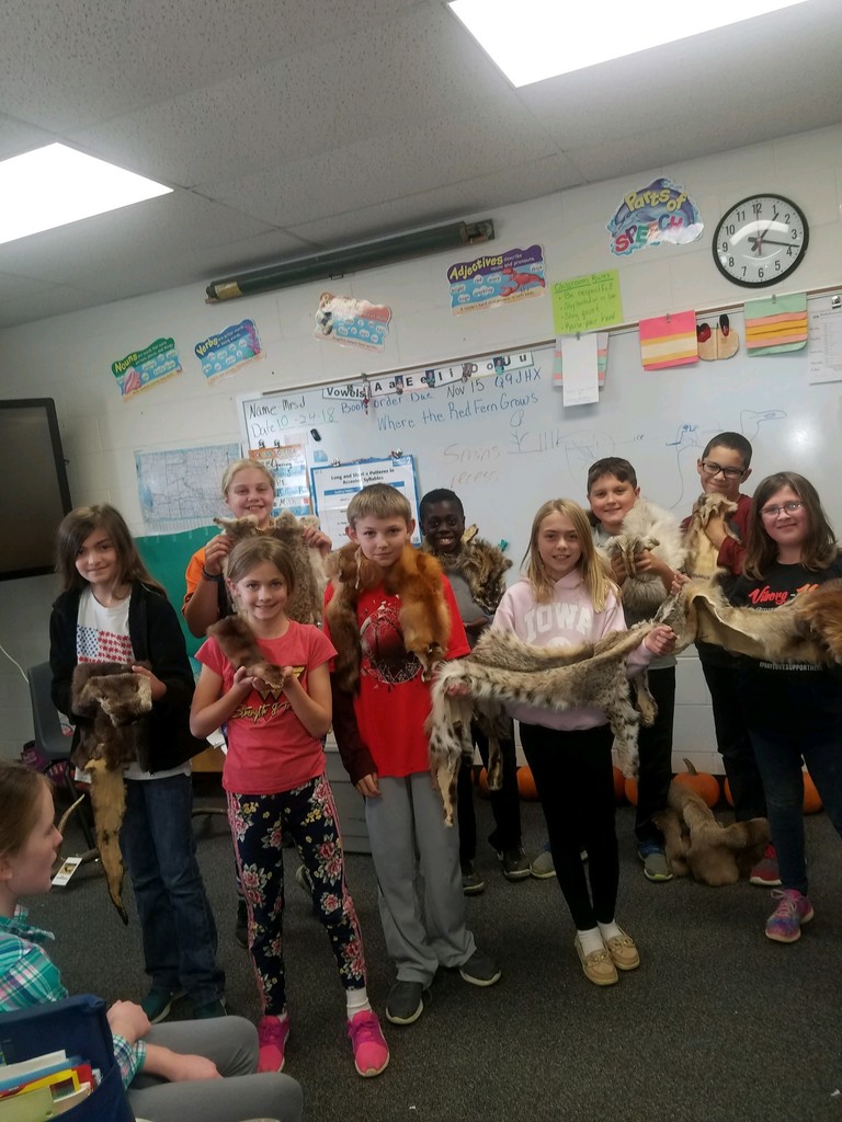 4th graders learning about animal pelts