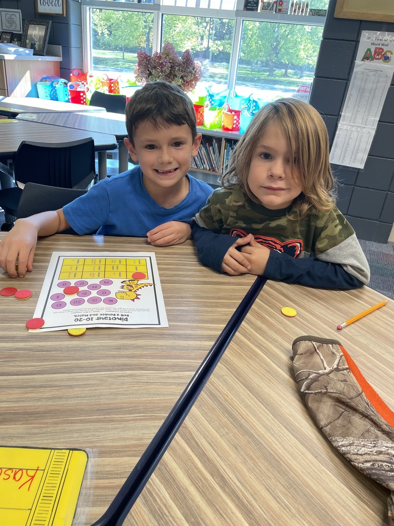 2 boys sitting at desk