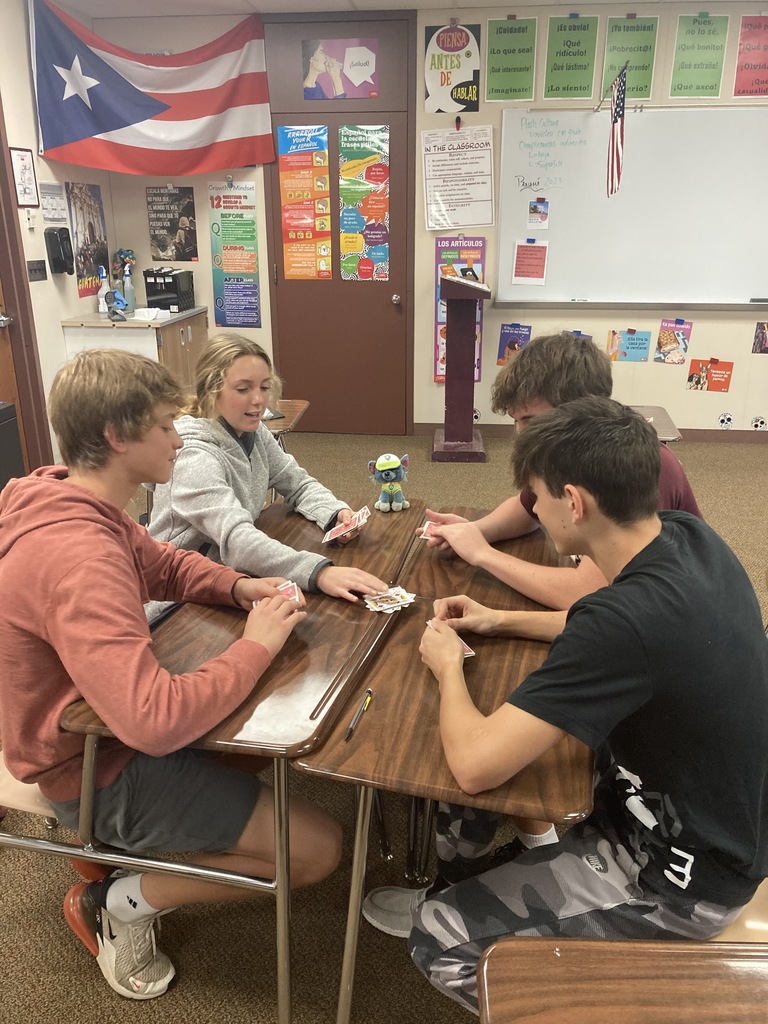 3 boys and 2 girls playing cards