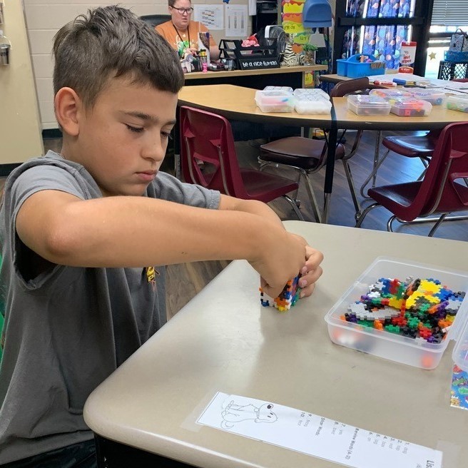 students using foam pieces to create blocks