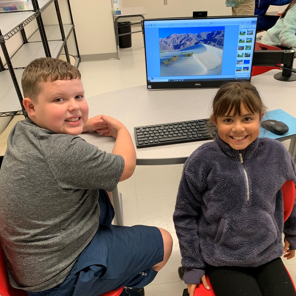 students in front of a computer