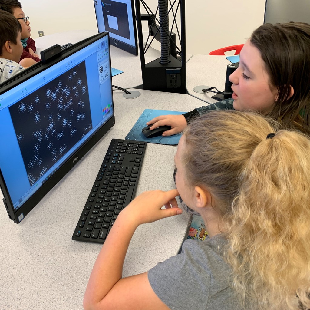 students in front of a computer