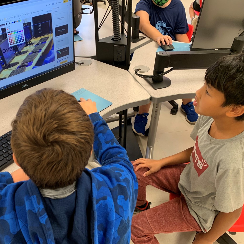 students in front of a computer