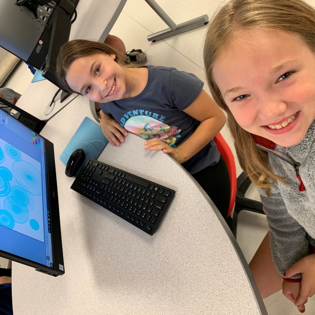 students in front of a computer