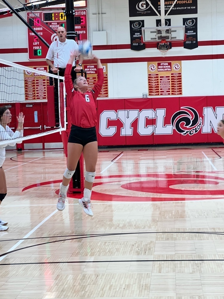 girl setting a volleyball 