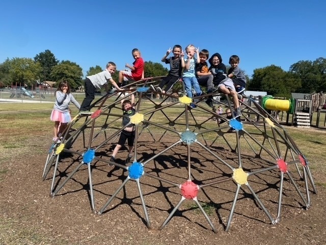 kids on playground equipment 