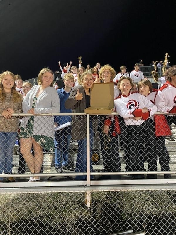 kids posing with pizza