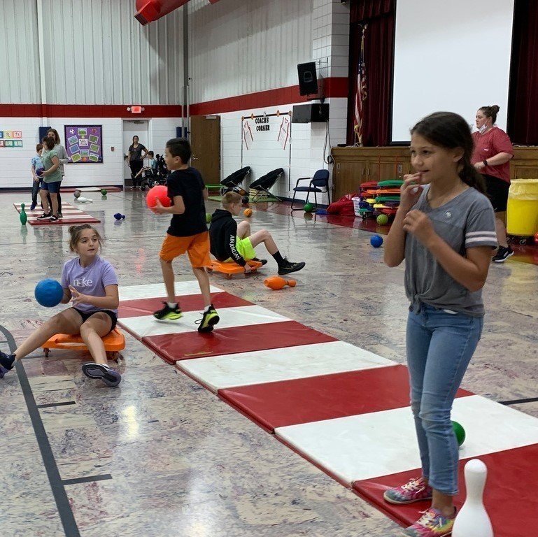 kids on scooters & on mats