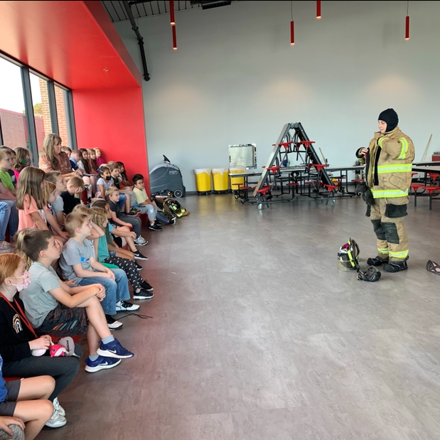 fireman putting on fire equipment