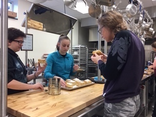 Spanish 4 students sample their pastelitos de guayaba.