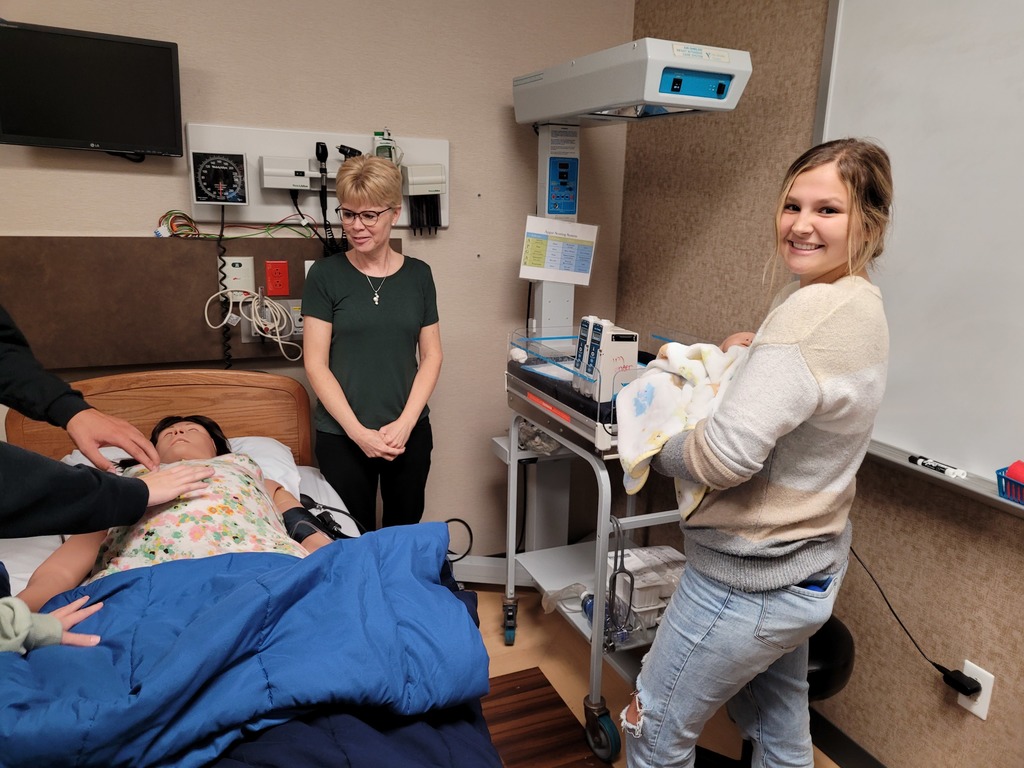 Students observing a patient