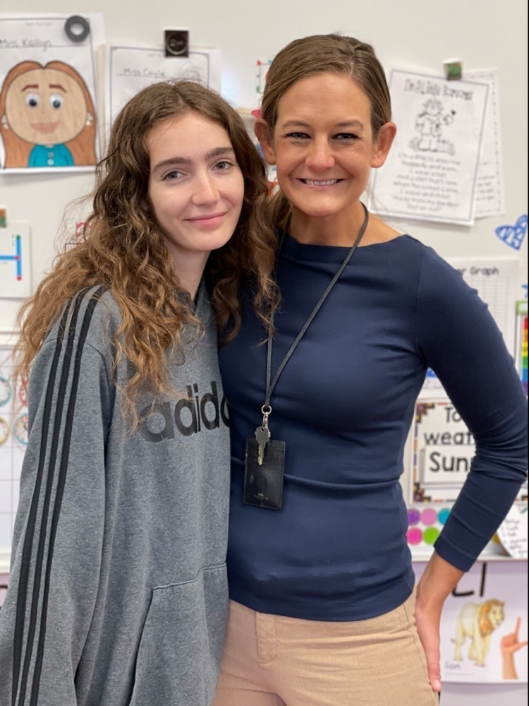 student and teacher posing 