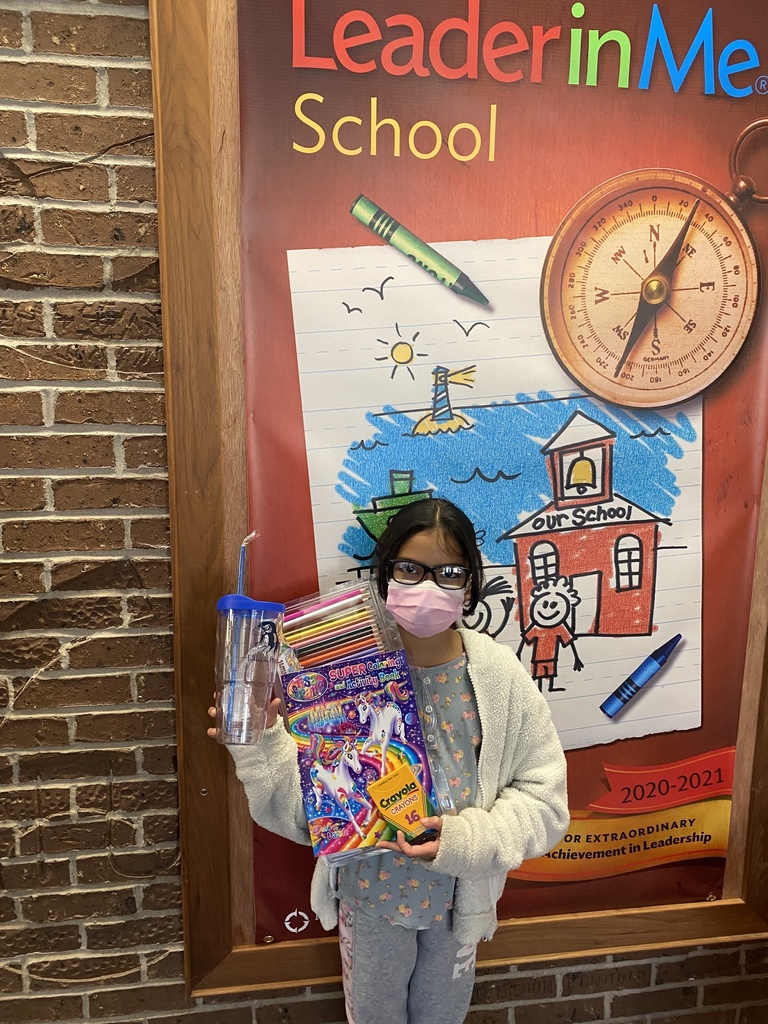 Image of Student Holding Reward