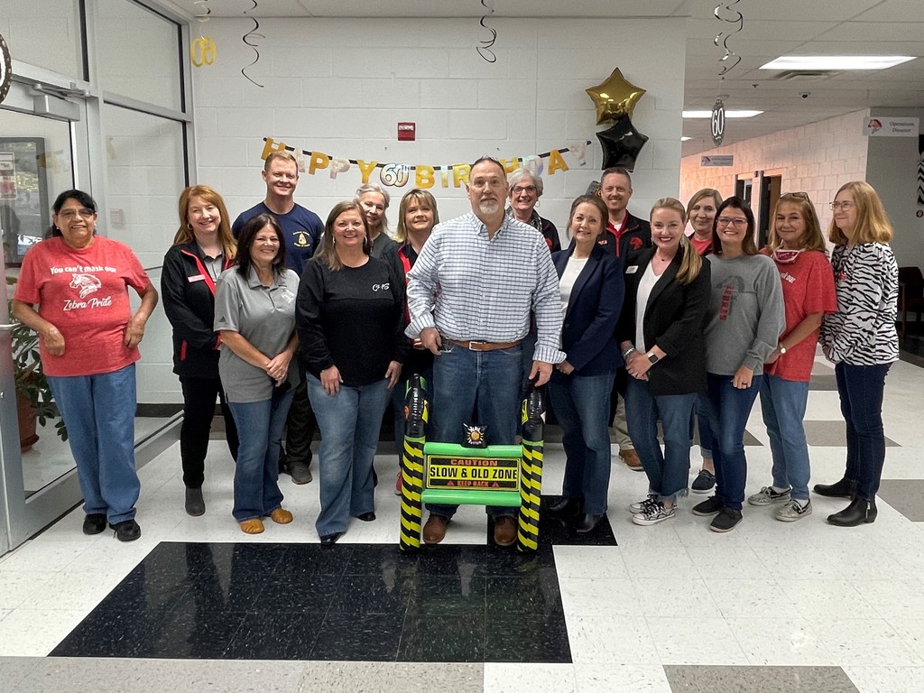 Mr Frazier with the staff from administration 