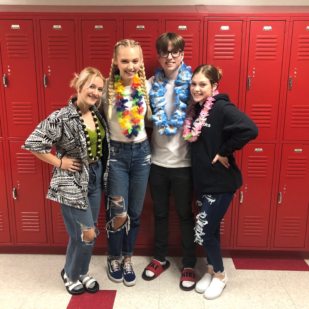 student in Hawaiian shirts lei