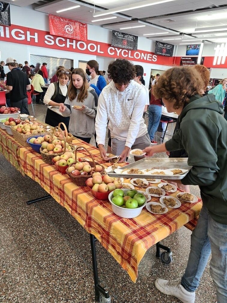 students getting apples 