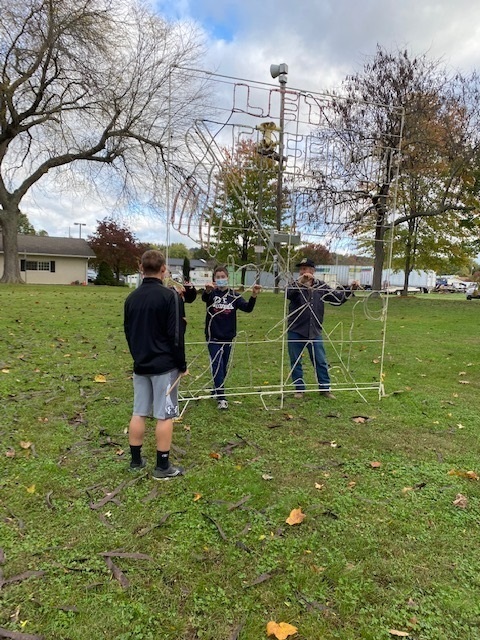 Students setting up light display