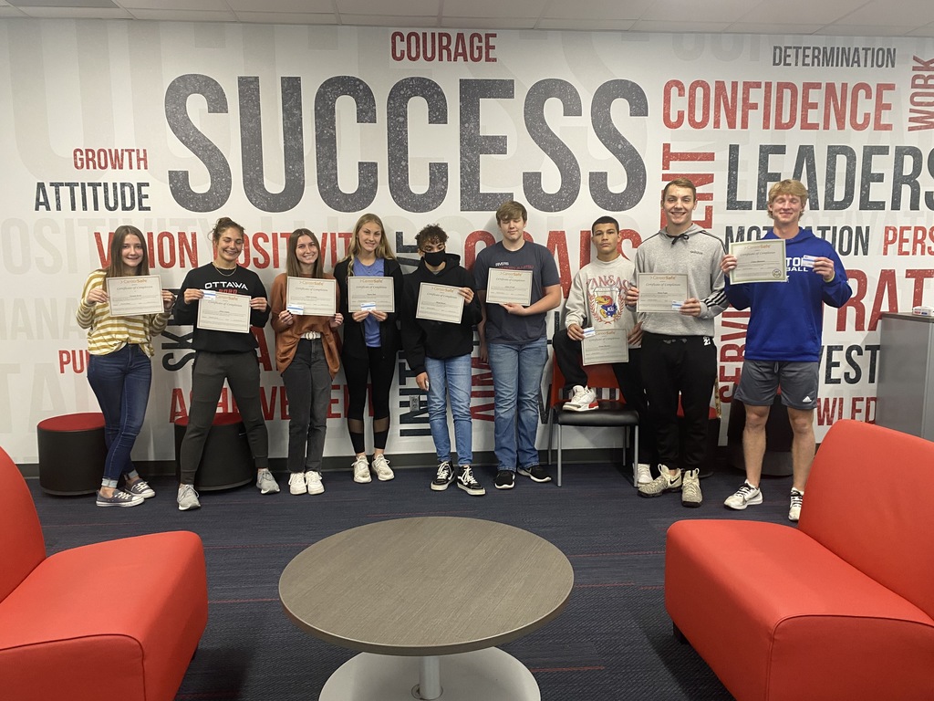students posing with certificates 