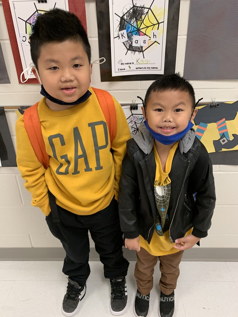 TWO BOYS IN YELLOW