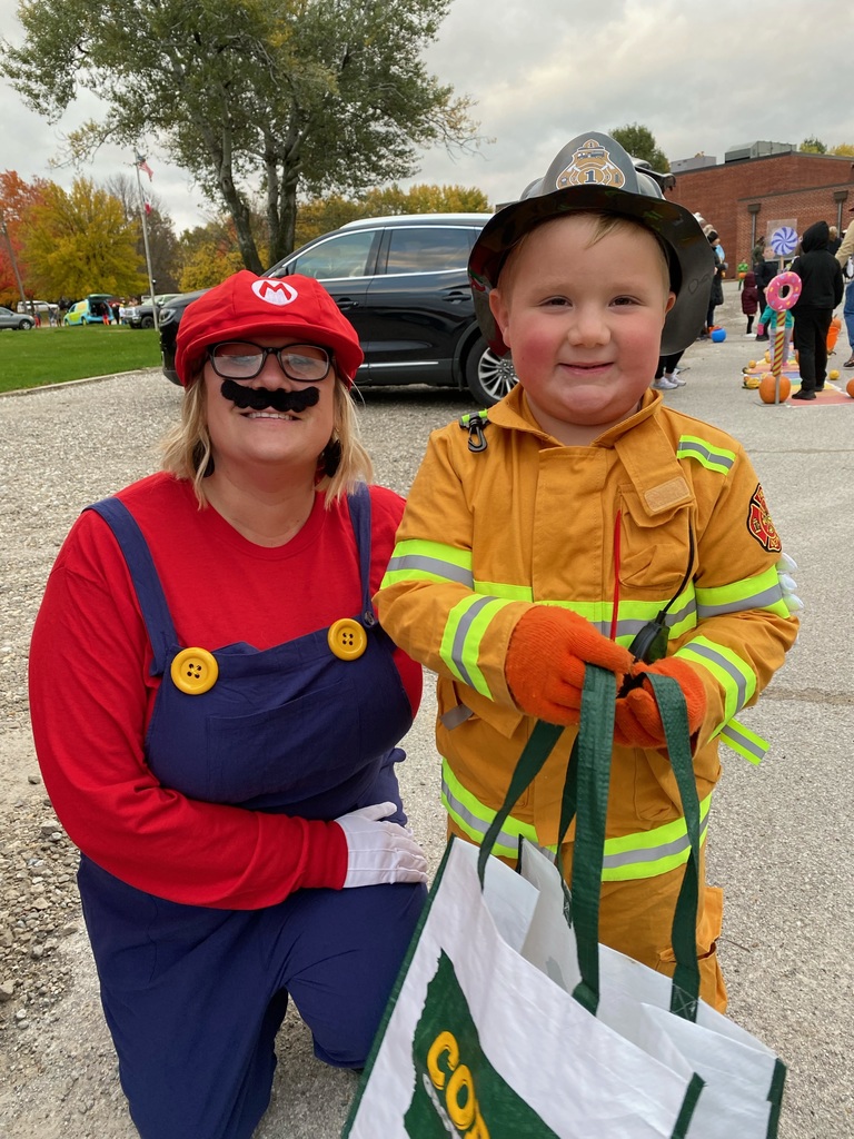 Student with staff dressed as Mario