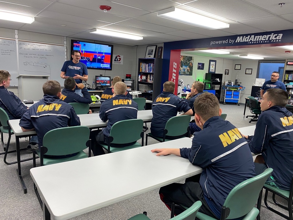 students in navy jackets in classroom